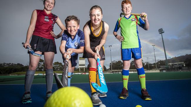 Junior hockey players (L-R) DiamondBacks' Wilhelmina Fish, Angus McMullen from North-West Grads, University's Audrey Bullard and OHA's Jack Woodberry. Picture: LUKE BOWDEN