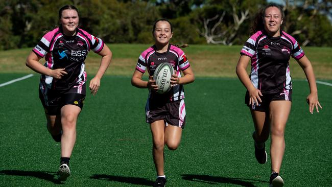 South East Magic 7s players Pearl Collins, 13, Tyra Dymock, 11, and Malia Dymock, 14, at Latham Park, South Coogee. The new season starts next month. Picture: Monique Harmer