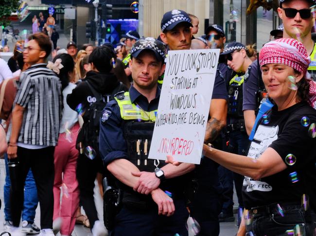 MELBOURNE AUSTRALIA - NewsWire Photos NOVEMBER 17, 2024: Pro-Palestinian protestors are seen along Bourke St Mall as retail giant Myer unveils its much-loved Christmas windows display.Picture: NewsWire / Luis Enrique Ascui