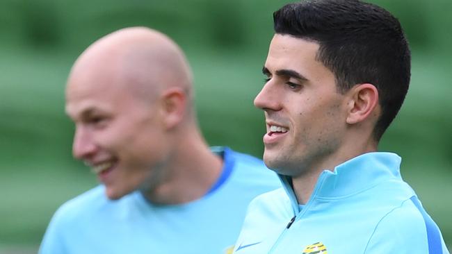 Aaron Mooy (Left) and Tom Rogic are seen training at AAMI Park in Melbourne, Sunday, September 3, 2017. Australia plays Thailand in their final group qualifier on Tuesday. AAP Image/Julian Smith) NO ARCHIVING