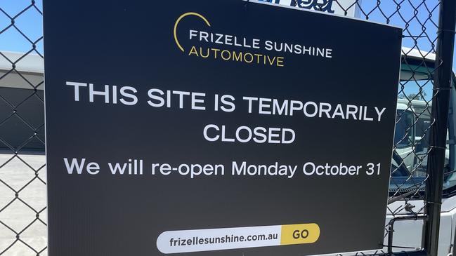 Signs outside the Gold Coast Isuzu which was closed after an explosion on Tuesday.