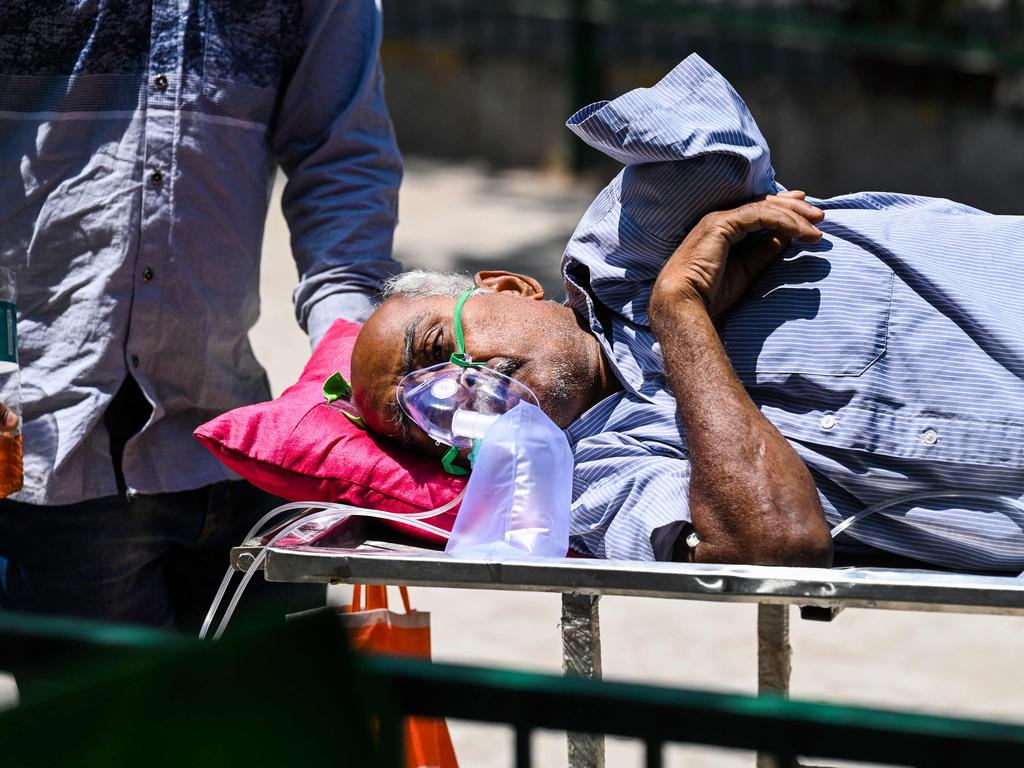 A COVID-19 coronavirus patient leaves a hospital in New Delhi.