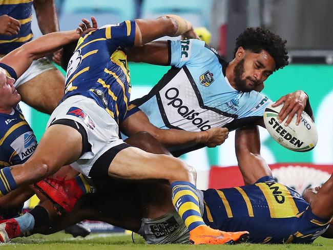 Cronulla's Ricky Leutele attempts try but puts ball down on the head of Parramatta's Michael Jennings during Game 2 of double header NRL match Parramatta Eels v Cronulla Sharks at ANZ Stadium. Picture. Phil Hillyard