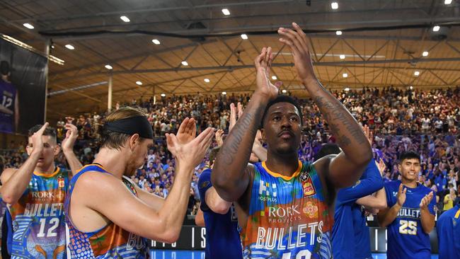 Lamar Patterson (centre) of the Bullets celebrates after a win over Melbourne United last season. Picture: AAP Image/Darren England