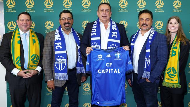 South Melbourne officials (centre three) Andrew Mesourouni, Nicholas Maikousis and Tass Roufos with James Johnson (left) and Natalie Lutz (right).