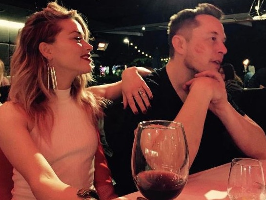 Amber Heard was photographed getting close with billionaire Elon Musk.