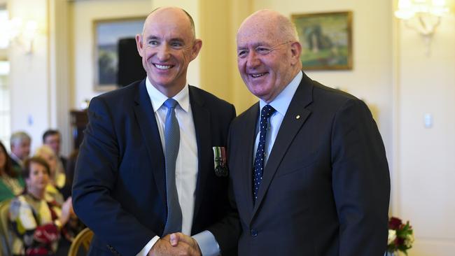 Stuart Robert shakes hands with Governor-General Sir Peter Cosgrove after being sworn-in as Assistant Treasurer on Tuesday. Picture: AAP