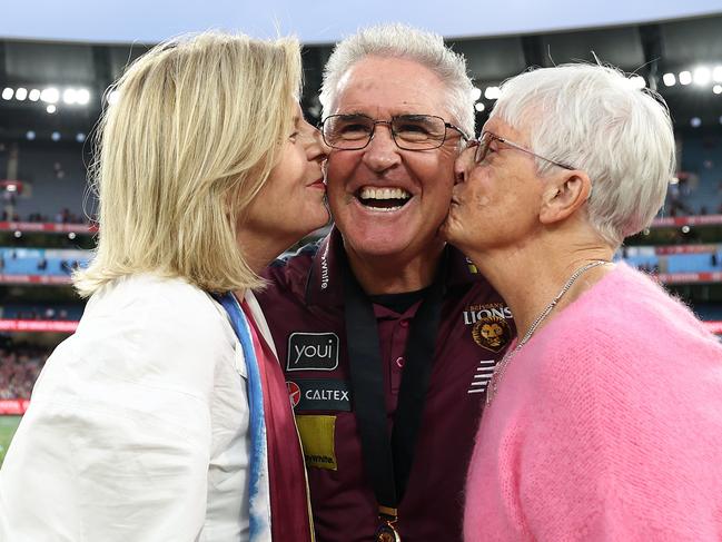 MELBOURNE, AUSTRALIA - SEPTEMBER 28: Chris Fagan, Senior Coach of the Lions poses with his wife Ursula and his mother Beth celebrate after the Lions defeated the Swans  the AFL Grand Final match between Sydney Swans and Brisbane Lions at Melbourne Cricket Ground, on September 28, 2024, in Melbourne, Australia. (Photo by Robert Cianflone/AFL Photos via Getty Images)