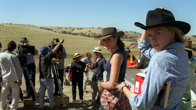 Lisa Chappell (left) with Jessica Napier in front of cameras on the McLeod’s Daughters set in 2002.