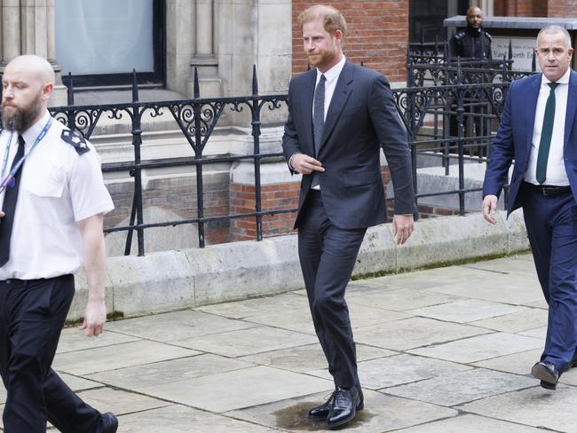 The Duke of Sussex was flanked by security. Picture: Getty Images