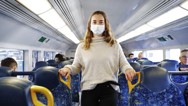 Face masks are now required on trains, Pictured is Lily Leighton, 22. Picture: Sam Ruttyn