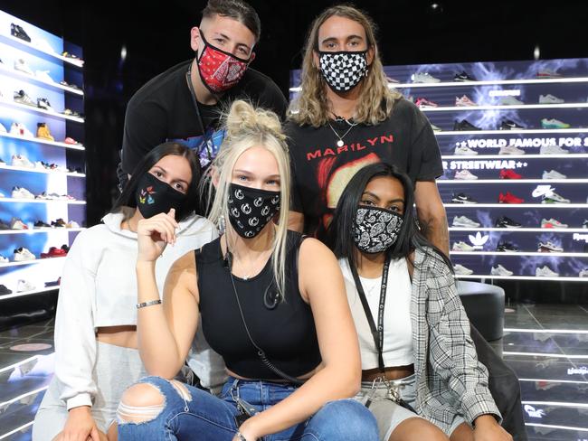 Part social responsibility, part keeping up with fashion, Culture Kings has launched over 200 face masks, bandana and face shield designs, ensuring Australians can both stay safe, while still showing their personality during the COVID-19 pandemic. Staff members wear the new accessory at Culture Kings Pacific Fair. ,From bottom left, Tiegan Blockley, Jacob Mason, Karla Bodycote, Dylan Harris(manager) and Natasha Ram. Picture Glenn Hampson