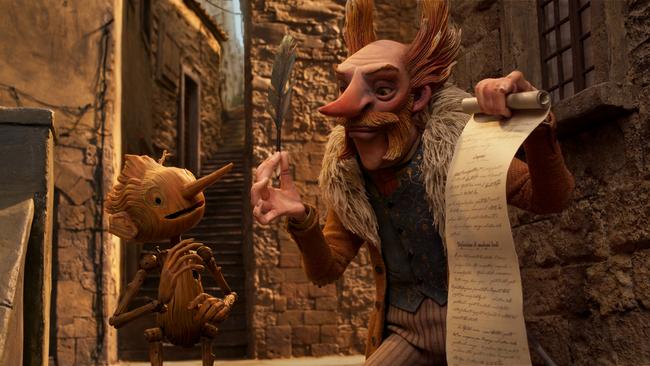 Guillermo del Toro's Pinocchio - (L-R) Pinocchio (voiced by Gregory Mann) and Count Volpe (voiced by Christoph Waltz)