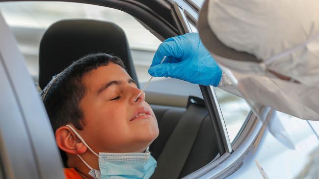 A child undergoing a coronavirus test. Picture: Ahmad Gharbali: AFP