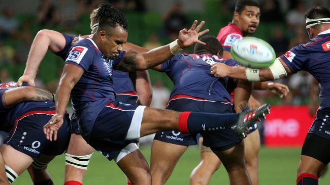 Will Genia of the Rebels kicks at AAMI Park in Melbourne.