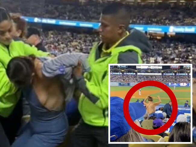 Fan ejected after exposing herself