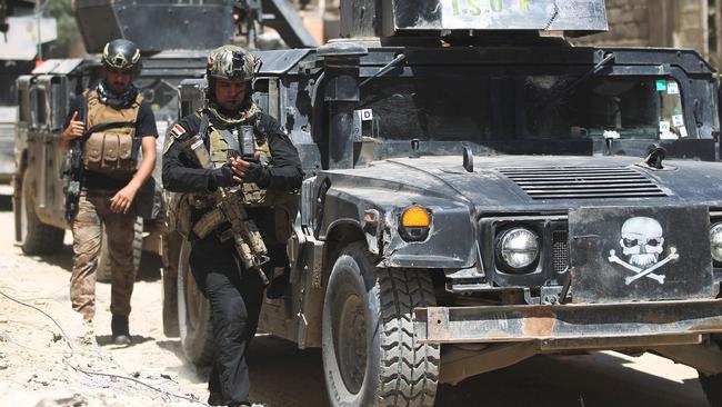 Iraqi counter-terrorism forces advance through West Mosul on Monday, the very same day as the Manchester attack. Picture: AFP/Ahmad Al-Rubaye