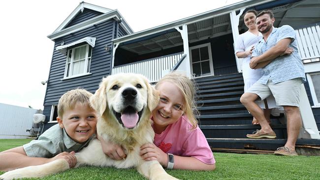 Steven and Brittany Keim with children Charleigh, 9, and Lachlan, 5, and puppy Lenny t their home in Wellington Point, which they are selling. Picture: Lyndon Mechielsen/The Australian