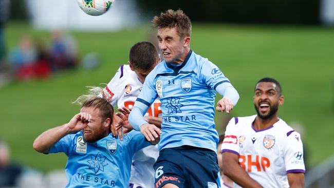 Sydney FC’s Joel King wins a header against Perth Glory. Picture: AAP