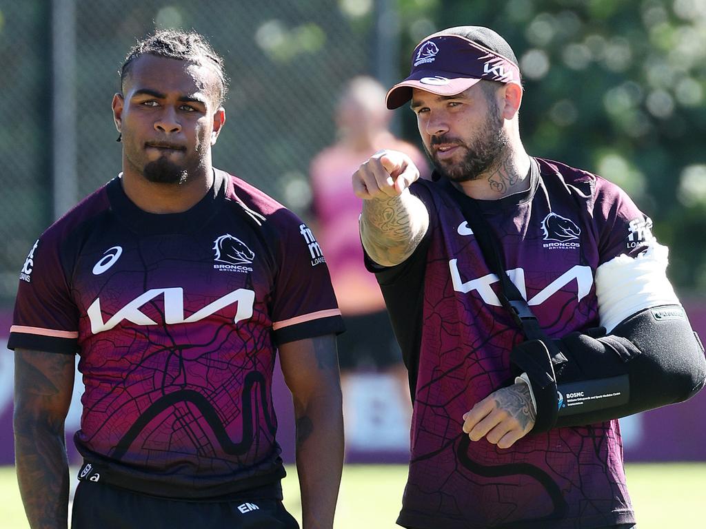 Ezra Mam talking with injured captain Adam Reynolds during a Broncos training session earlier this year. Picture: Liam Kidston