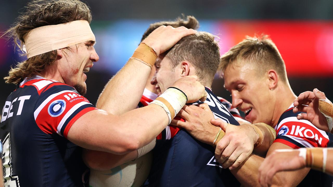 Sam Walker was swamped by teammates after his first NRL try.