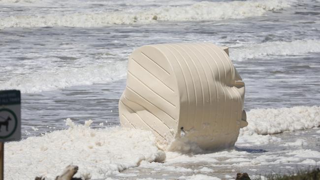 A water tank washed up on Sharpes Beach at Skennars Head, north of Ballina, during flooding on Wednesday. Picture: Liana Boss