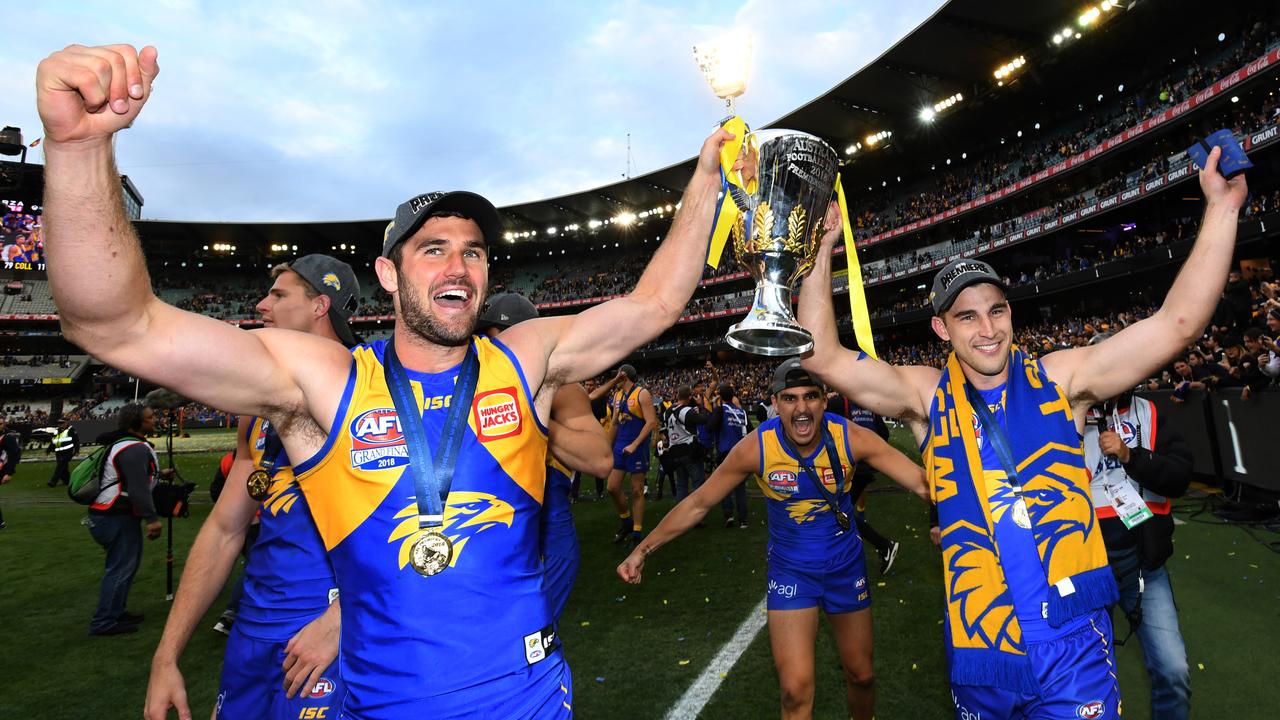Jack Darling and Elliot Yeo hold the premiership cup aloft.