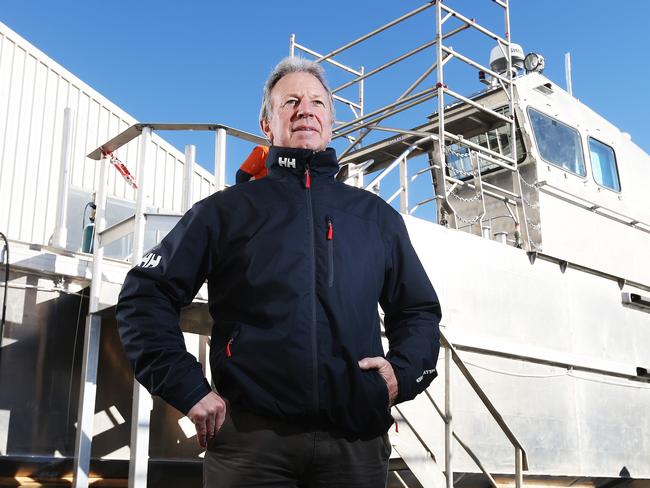 Director of shipbuilder company Taylor Bros, Phillip Taylor in front of a landing barge for the Antarctic Division. Picture: Zak Simmonds