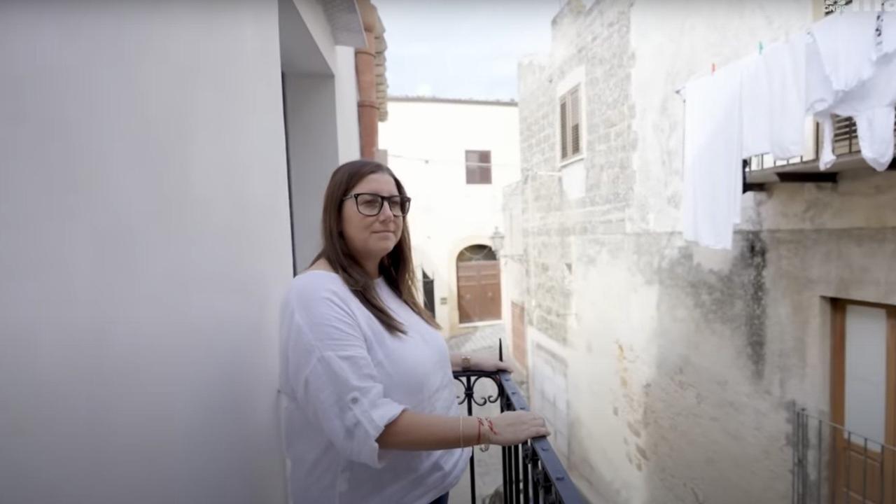 Meredith Tabbone enjoys the balcony of her newly completed Italian home. Picture: CNBC Make It/YouTube