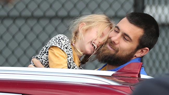 The West Coast Eagles’ Josh Kennedy with his daughter Lottie before he flew from Perth to Queensland on Tuesday, his 33rd birthday. Picture: Getty Images