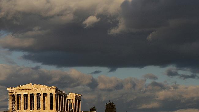 The ancient Parthenon temple stands under a lowering sky. Picture: AP