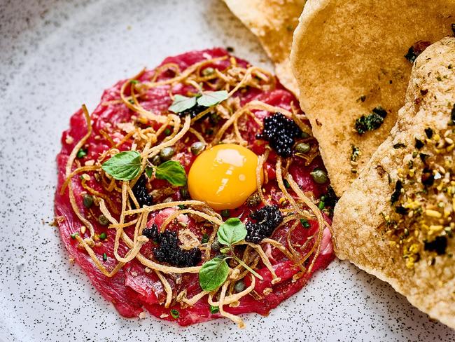 Beef Tataki – Binnie Beef Wagyu (MS6+), smoked miso, enoki, caviar, cassava crisps at Earp Distilling in Newcastle. Picture: David Griffen Photography/Supplied