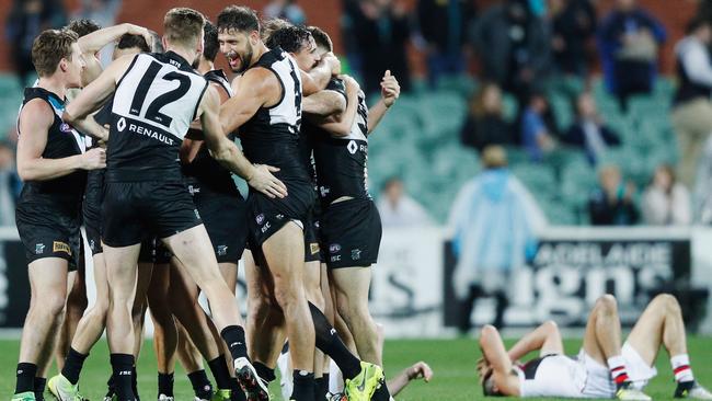 Robbie Gray of the Power, who kicked the winning goal, is mobbed after the final siren. Picture: Michael Dodge/Getty Images.