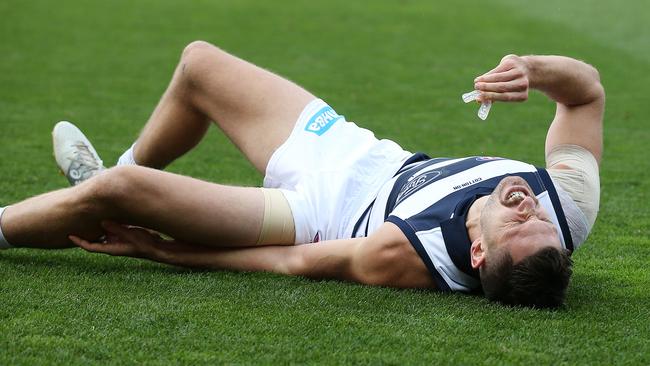 Aaron Black screams in pain after injuring his knee. Picture: Michael Klein