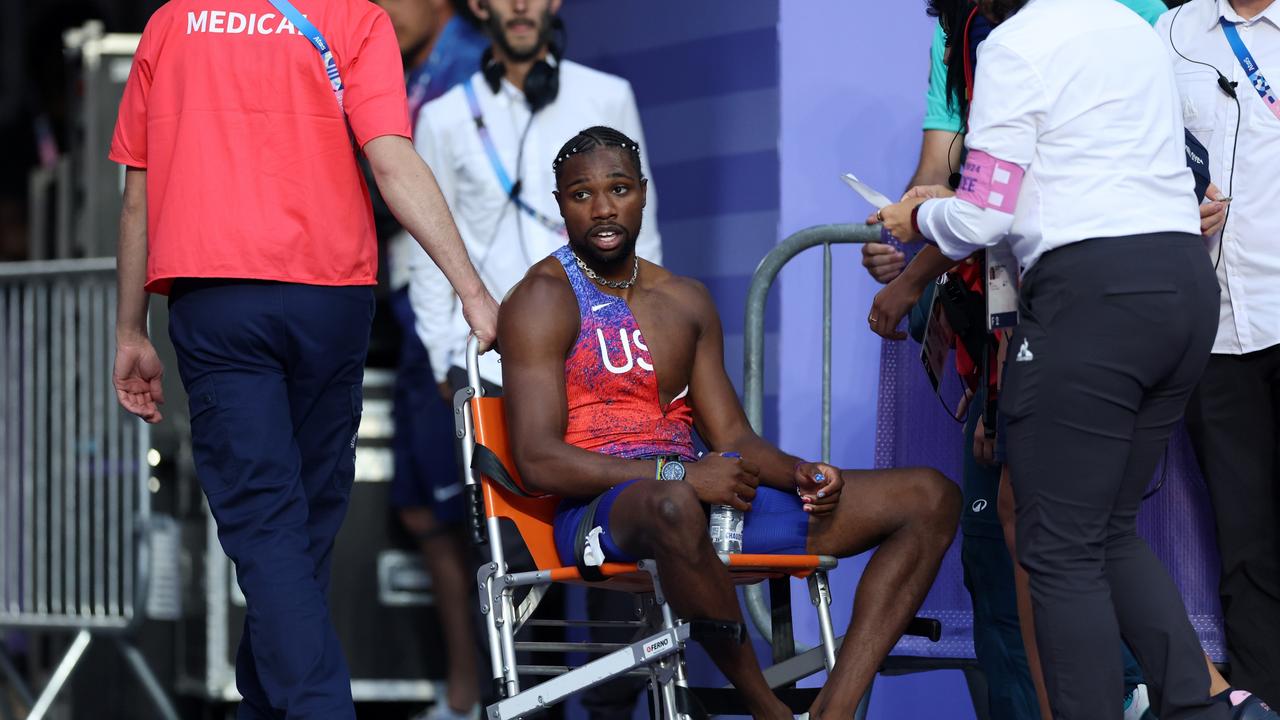 Lyles was taken from the track in a wheelchair. (Photo by Christian Petersen/Getty Images)