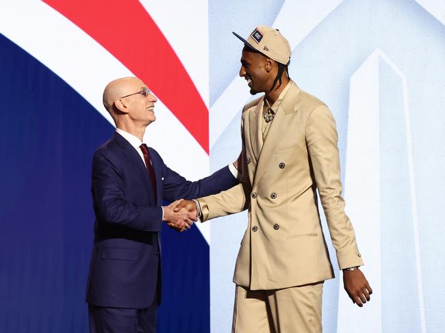 Alex Sarr shakes hands with NBA commissioner Adam Silver after being unveiled as the second pick in the 2024 NBA draft. Picture: Getty Images