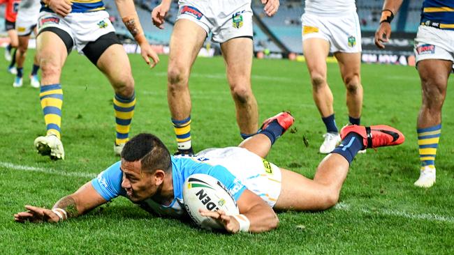 Phillip Sami crossed the white stripe for the Titans. (AAP Image/Brendan Esposito)