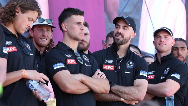 Collingwood players on stage after the AFL Grand Final Parade at Yarra Park in Melbourne on Friday. Picture Lachie Millard