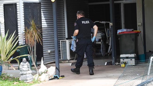 Police investigate the crime at Mr Marshall’s Malak home. Picture: Katrina Bridgeford