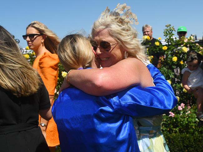 MELBOURNE, AUSTRALIA - MARCH 09: Jamie Kah riding Cylinder is hugged by Belinda Holland after winning Race 5, the Yulong Newmarket Handicap, during Melbourne Racing at Flemington Racecourse on March 09, 2024 in Melbourne, Australia. (Photo by Vince Caligiuri/Getty Images)