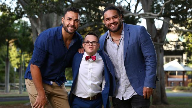 Ethan Sloane from the Mudgeeraba Special School dressed up for his recent school formal and to help him enjoy his night Titans player Ryan James and Konrad Hurrell helped get him there. Picture: David Clark