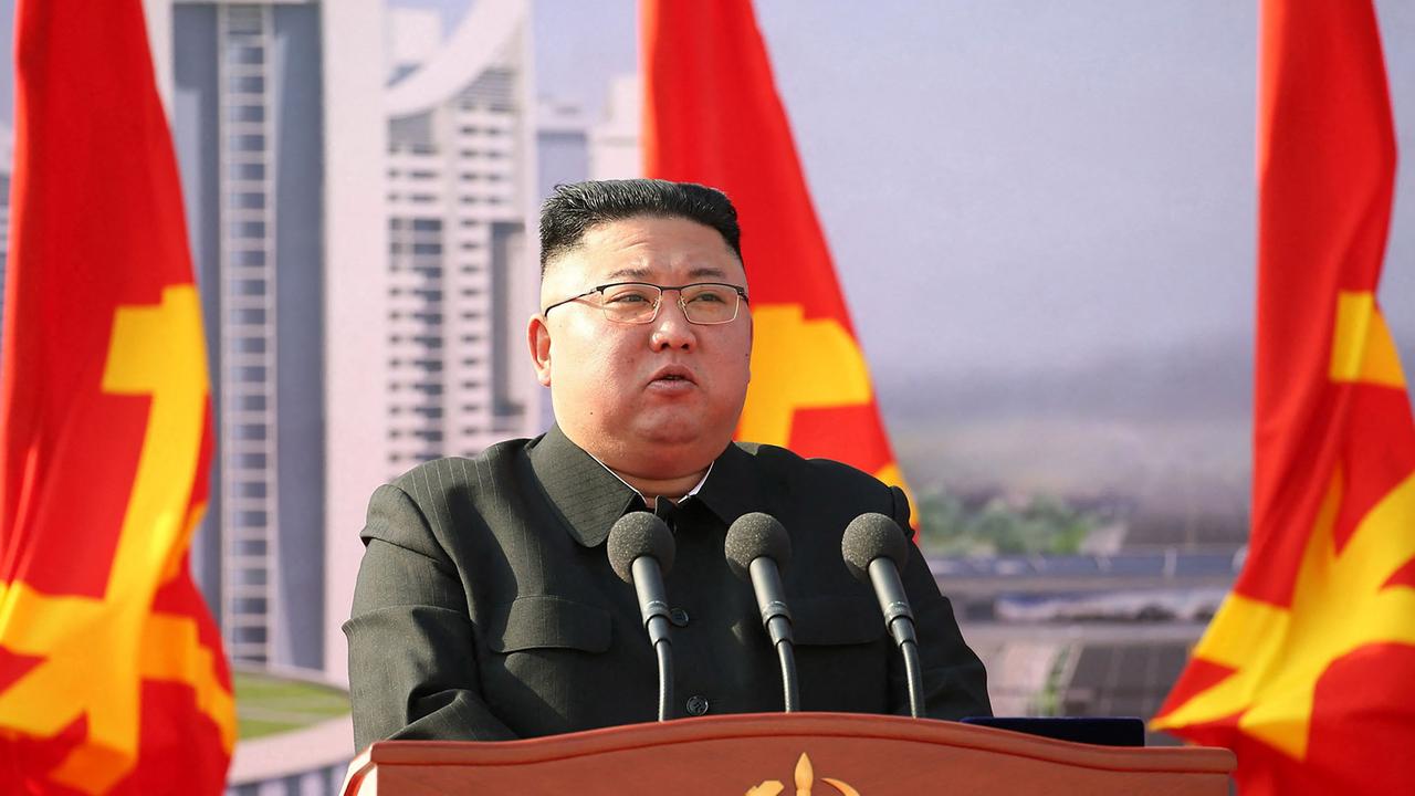 In this picture taken on March 23, 2021 Kim Jong-un speaks at ceremony for a construction project. Picture: AFP PHOTO/KCNA VIA KNS