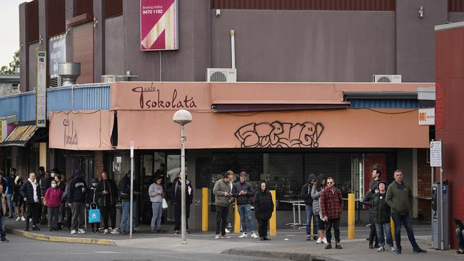 People are seen queuing outside a Centrelink office in Preston, Melbourne on Tuesday. Picture: AAP Image/Stefan Postles.