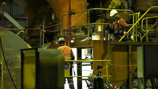 Workers inside the turbine hall at Liddell Power Station in the Hunter Valley. Picture: Jane Dempster/The Australian