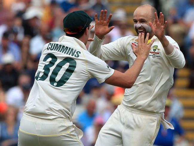 Nathan Lyon celebrates with Pat Cummins during play on the fifth day of the first Ashes Test match at Edgbaston. Picture: Lindsey Parnaby/AFP