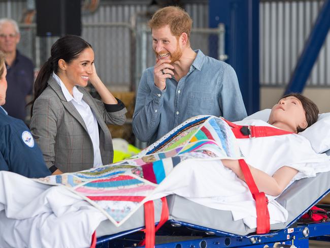 Meghan and Prince look at medical training equipment, meant to simulate a pregnant patient. Picture: Getty