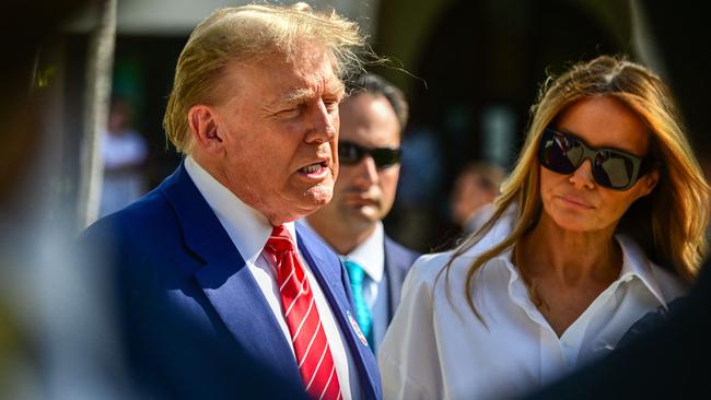 Former US President and Republican presidential candidate Donald Trump (L) and former First Lady Melania Trump arrive to vote in Florida's primary election at a polling station, on March 19, 2024. (Photo by GIORGIO VIERA / AFP)