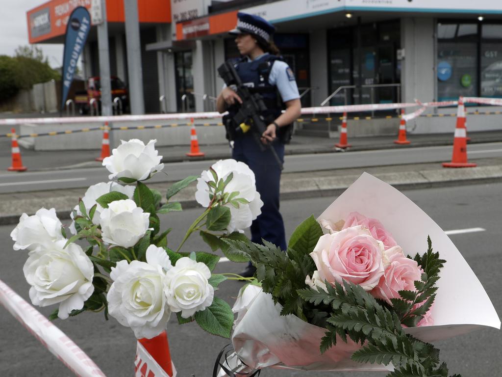 A police officer stands at a police cordon at an intersection near the Linwood Mosque in Christchurch. Picture: AP