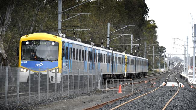 MELBOURNE, AUSTRALIA - NewsWire Photos NOVEMBER 04, 2021: A Metro train runs on the existing track next to the rail duplication project at the Cranbourne rail line in Melbourne's outer south-east. Picture: NCA NewsWire / Andrew Henshaw