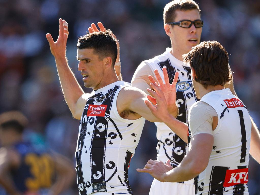 MELBOURNE, AUSTRALIA - MAY 18: Scott Pendlebury of the Magpies celebrates a goal with teammates during the 2024 AFL Round 10 match between The Collingwood Magpies and Kuwarna (Adelaide Crows) at The Melbourne Cricket Ground on May 18, 2024 in Melbourne, Australia. (Photo by Dylan Burns/AFL Photos via Getty Images)